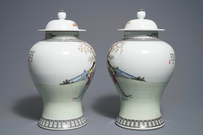 A pair of Chinese famille rose vases and covers, Qianlong mark, 20th C.