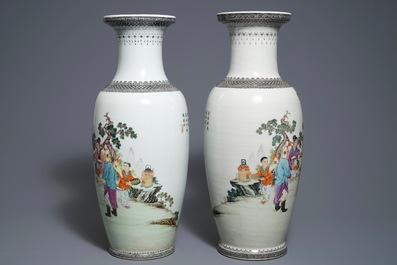 A pair of Chinese famille rose vases with figures in a garden, Qianlong mark, 20th C.
