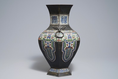 An archaic Chinese bronze and champlev&eacute; enamel vase, 19th C.