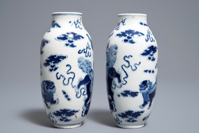 A pair of Chinese blue and white 'buddhist lions' vases, Kangxi mark, 19th C.