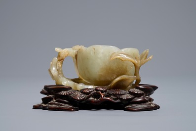 A Chinese lotus-shaped jade libation cup on stand, 18/19th C.