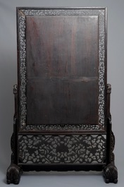 A large Chinese carved zitan wood panel with jade and turquoise, set in a hongmu wood frame and stand, Qianlong