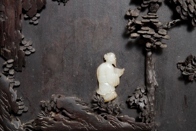 A large Chinese carved zitan wood panel with jade and turquoise, set in a hongmu wood frame and stand, Qianlong