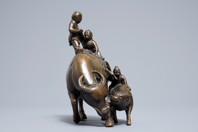 A Chinese bronze group with boys and buffaloes, 19th C.