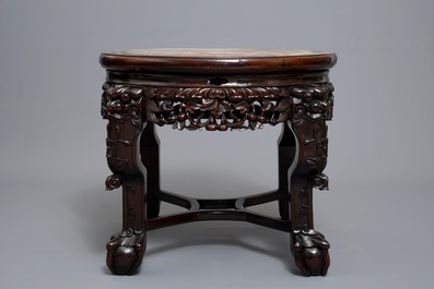 A Chinese wooden stand with marble top and mother of pearl inlay, 19/20th C.