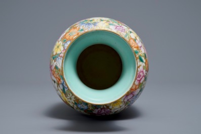 A Chinese famille rose millefleurs vase, Qianlong mark, 20th C.