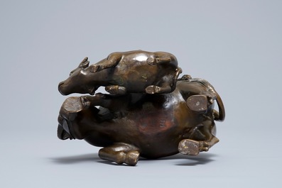 A Chinese bronze group with boys and buffaloes, 19th C.