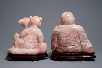 Two large Chinese pink quartz figures on wooden stands, 20th C.