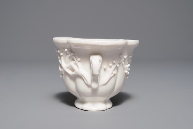 A Chinese quatrefoil blanc de Chine two-handled wine cup, Kangxi