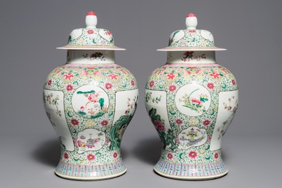 A pair of Chinese famille rose vases and covers with birds among flowers, Qianlong mark, 19th C.