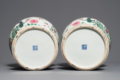 A pair of Chinese famille rose vases and covers with birds among flowers, Qianlong mark, 19th C.