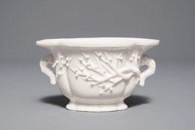 A Chinese quatrefoil blanc de Chine two-handled wine cup, Kangxi