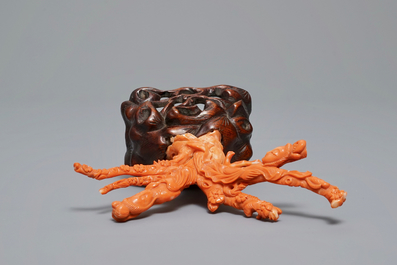 A Chinese carved red coral group of two ladies on wooden stand, 19/20th C.