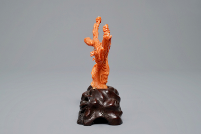 A Chinese carved red coral group of two ladies on wooden stand, 19/20th C.