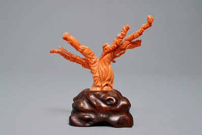A Chinese carved red coral group of two ladies on wooden stand, 19/20th C.