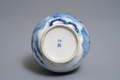 A Chinese blue and white bottle vase with a fisherman, 19th C.