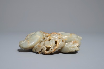 A Chinese celadon and russet jade 'rams' group, 18/19th C.