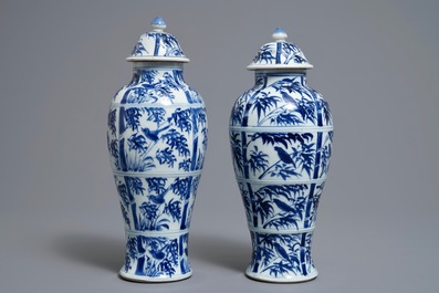 A pair of Chinese blue and white vases and covers with birds on bamboo branches, Kangxi