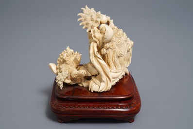 A Chinese ivory group of a Buddhist lion with cub, ca. 1920