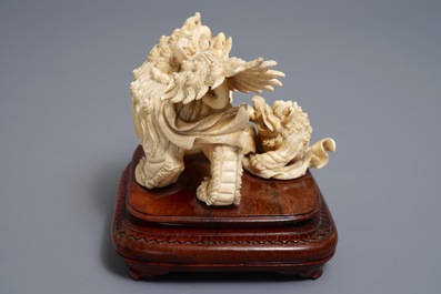 A Chinese ivory group of a Buddhist lion with cub, ca. 1920