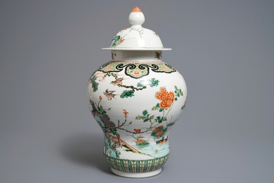 A Chinese famille verte vase and cover with birds and phoenixes, 19th C.