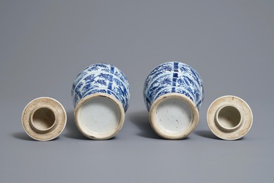 A pair of Chinese blue and white vases and covers with birds on bamboo branches, Kangxi