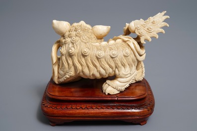 A Chinese ivory group of a Buddhist lion with cub, ca. 1920