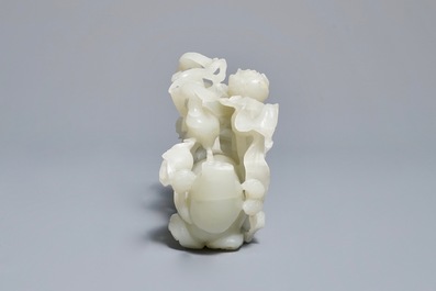 A Chinese celadon jade 'cranes' group on carved wooden base, Qing