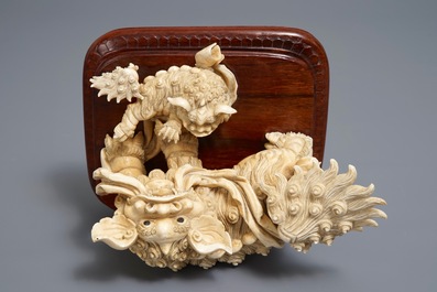 A Chinese ivory group of a Buddhist lion with cub, ca. 1920