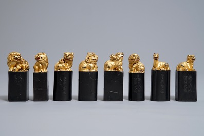 Eight Chinese parcel-gilt ink stones shaped as seals in display box, 18/19th C.