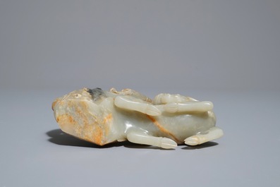 A Chinese celadon and russet jade 'rams' group, 18/19th C.