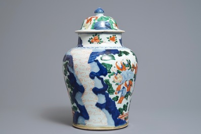 A Chinese wucai baluster vase and cover with playing boys, Transitional period