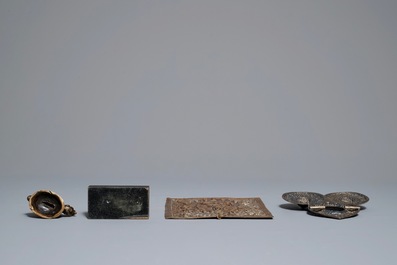 Two Tibetan votive plaques, a coral-inlaid silver amulet and a small bronze group, 18/19th C.