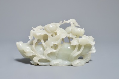 A Chinese celadon jade 'cranes' group on carved wooden base, Qing