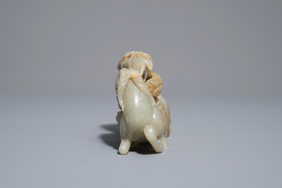 A Chinese celadon and russet jade 'rams' group, 18/19th C.