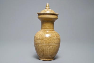 A Chinese brown-glazed vase and cover with floral anhua design, Song or later