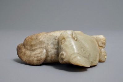 A Chinese pale greenish-grey and brown jade model of a mythical beast, Qing