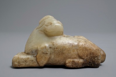 A Chinese pale greenish-grey and brown jade model of a mythical beast, Qing