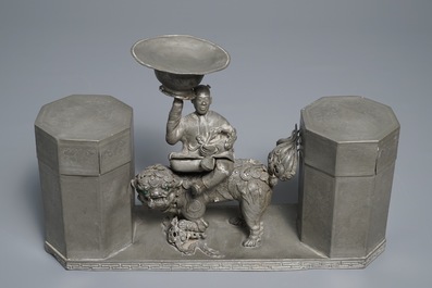 A large Chinese pewter double tea caddy with a central figure, impressed marks, 19th C.