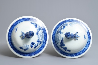 A pair of large Chinese blue and white vases and covers with birds among flowers, 19th C.