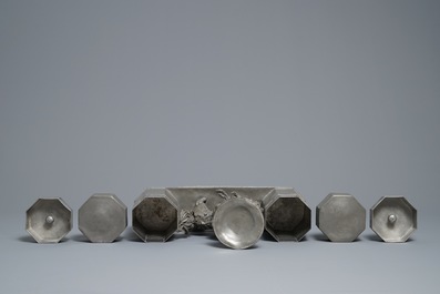 A large Chinese pewter double tea caddy with a central figure, impressed marks, 19th C.