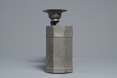 A large Chinese pewter double tea caddy with a central figure, impressed marks, 19th C.