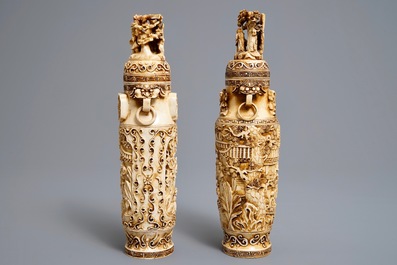 A pair of Chinese ivory vases and covers with figures in landscapes, 1st quarter 20th C.
