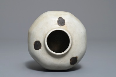 Un petit vase globulaire en porcelaine de Chine qingbai aux t&acirc;ches de rouille, Yuan