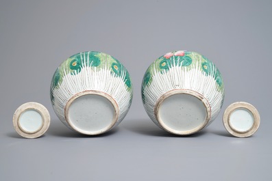 A pair of Chinese famille rose 'cabbage' jars and covers, 19th C.