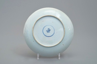 Two Chinese blue and white Ming-bowls and a plate with figures in garden, Kangxi