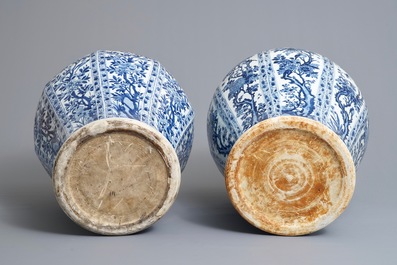 A pair of large Chinese blue and white octagonal baluster vases and covers, Kangxi