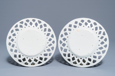 A pair of polychrome Dutch Delft butter tubs with applied design on reticulated stands, 18th C.