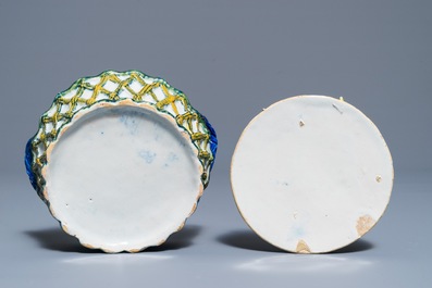 A pair of polychrome Dutch Delft butter tubs with applied design on reticulated stands, 18th C.