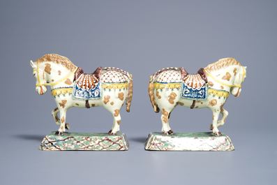 A pair of polychrome Dutch Delft lime-green ground models of circus horses, 19th C.